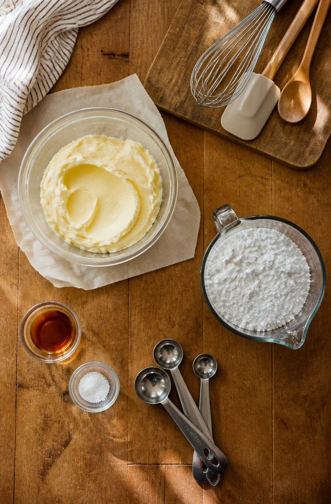 A list of ingredients for making buttercream frosting displayed on a countertop.