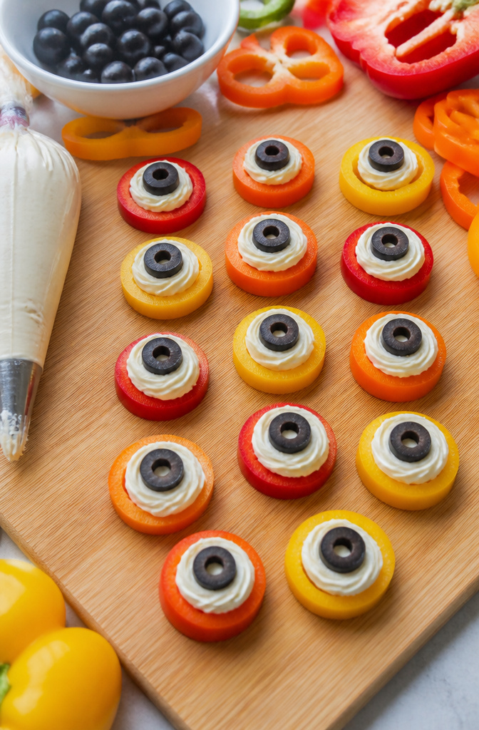 15 Gluten-Free Halloween Snacks for Parties and School Treats 9 Colorful bell pepper circles with cream cheese and olive slices.
