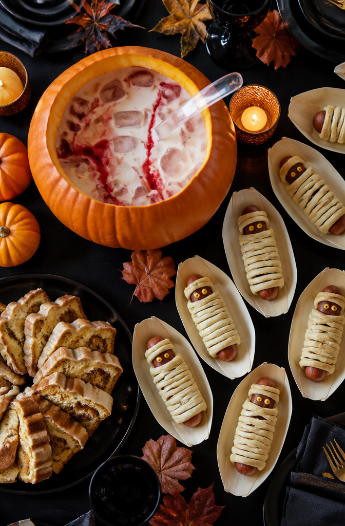 8 Halloween Party Ideas Adults Can Actually Use 4 A Halloween-themed drink and food spread featuring colorful treats.